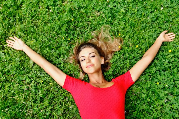 Woman on lawn after nootropic for anxiety